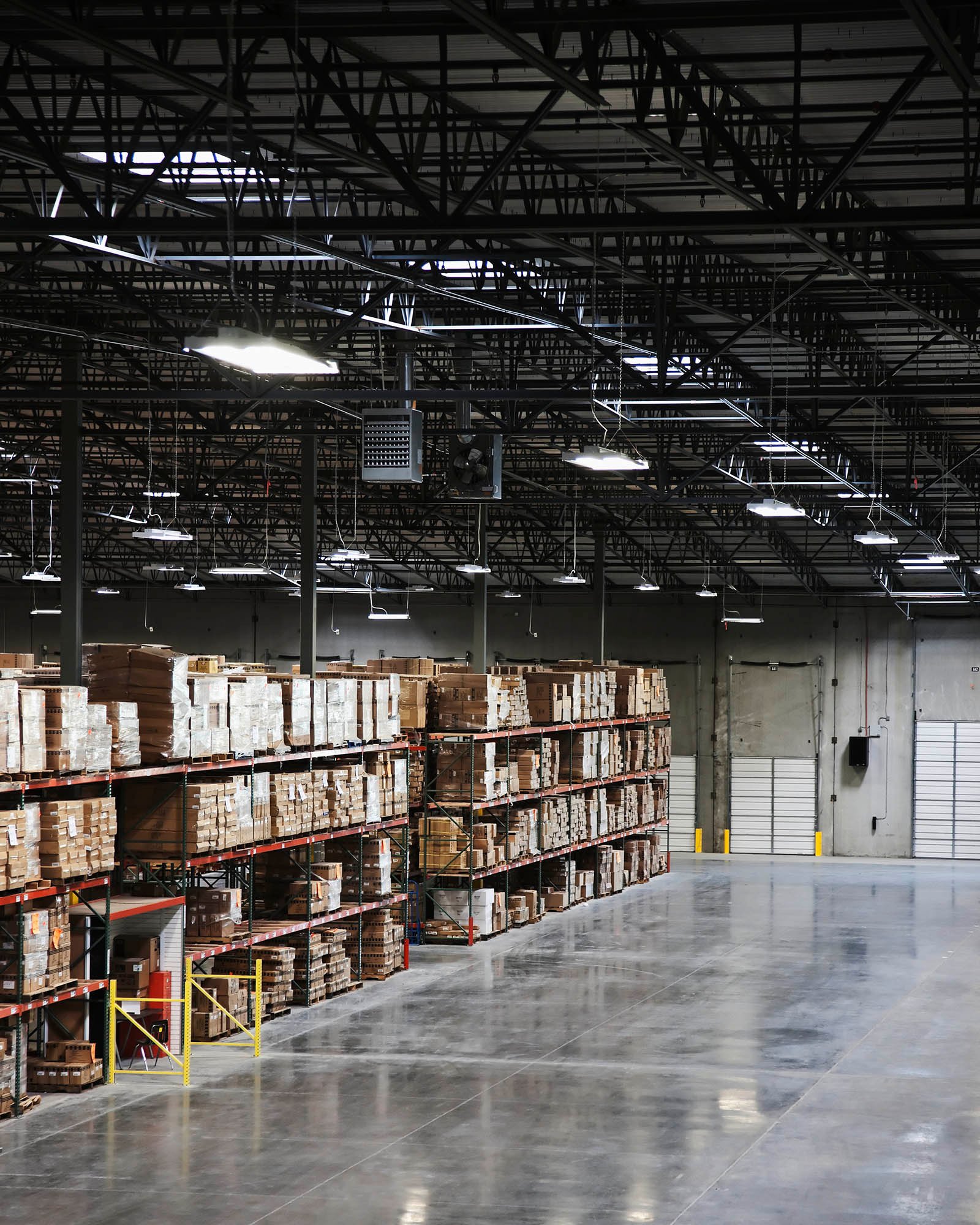 Cardboard boxes on shelves in warehouse